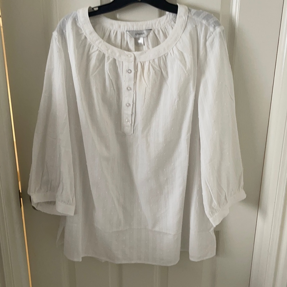 A white 3/4 length sleeve blouse